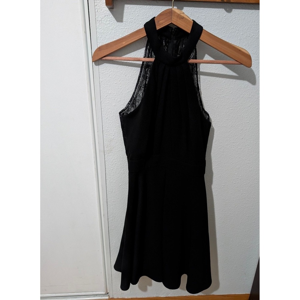 Elegant and modern, this BCBGeneration black halter dress combines classic sophi